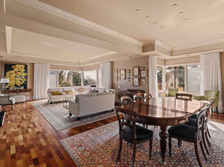This stunning property boasts a spacious living area with a beautiful dining space, perfect for entertaining.