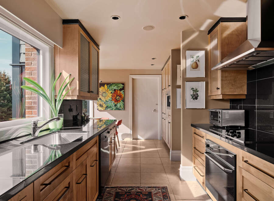 This stunning kitchen boasts a sleek, modern design with high-end appliances and ample counter space.