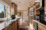 This stunning kitchen boasts a sleek, modern design with high-end appliances and ample counter space.