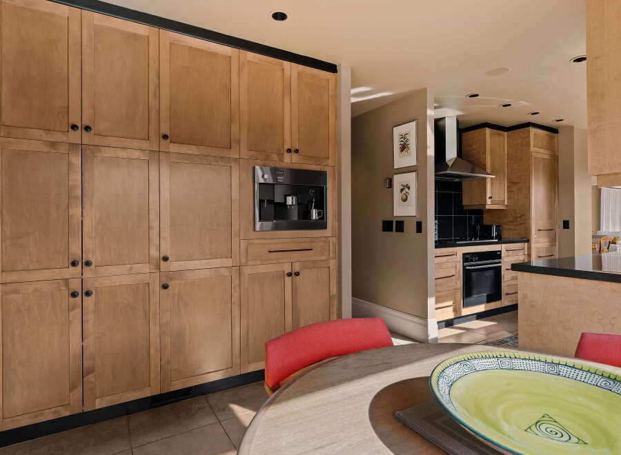 This stunning kitchen boasts custom cabinetry and high-end appliances, perfect for the discerning chef.