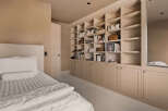This bedroom boasts a custom built-in bookcase, providing ample storage and a touch of elegance.