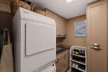 Discover the convenience of this well-appointed laundry room, featuring a modern Miele washer and dryer set.