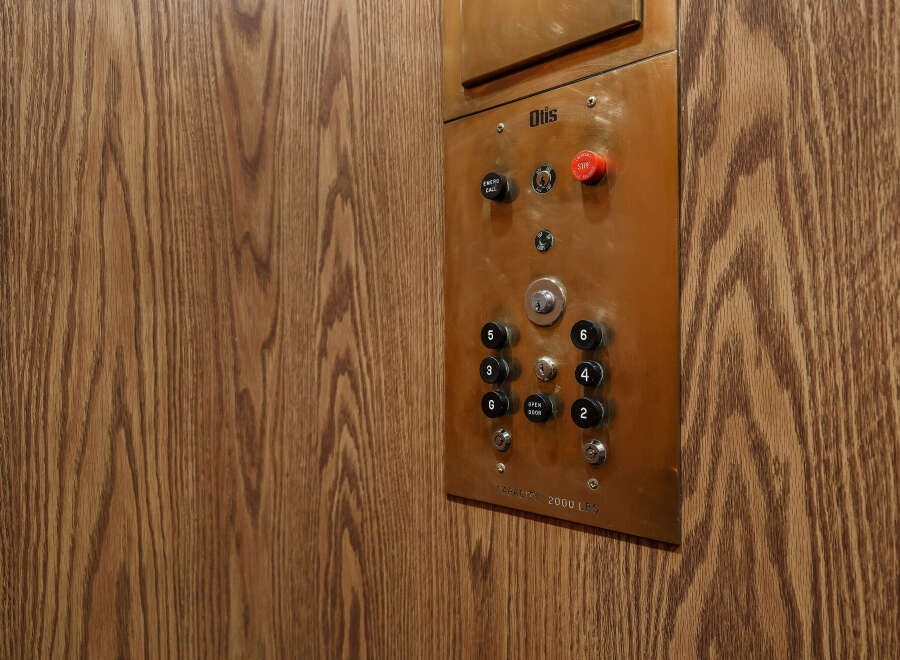 This image showcases an elevator control panel, a common feature in multi-story buildings.