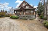 This stunning Craftsman-style home boasts exquisite architectural details and a welcoming facade.