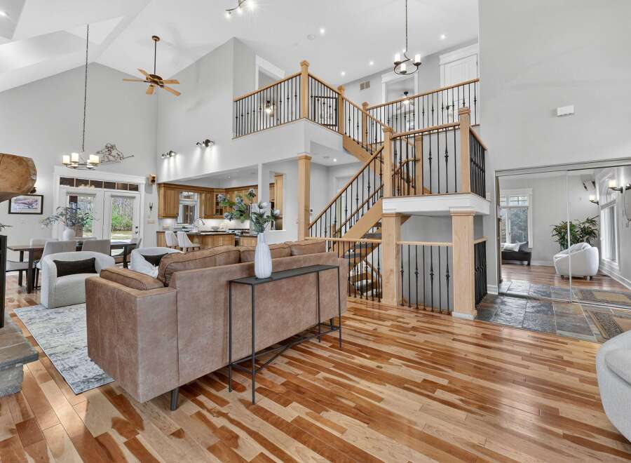 Step into luxury with this stunning property, boasting a grand two-story design and exquisite hardwood floors throughout.
