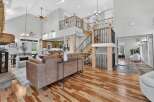Step into luxury with this stunning property, boasting a grand two-story design and exquisite hardwood floors throughout.