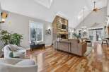 Step into luxury with this stunning living room, featuring a cozy fireplace and a modern design.