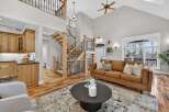 Step into luxury with this stunning home featuring a grand staircase and an open-concept living area.