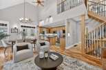 Step into luxury with this stunning property featuring a spacious open floor plan and soaring ceilings.