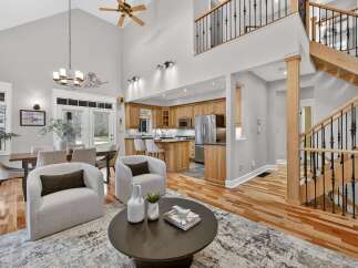 Step into luxury with this stunning property featuring a spacious open floor plan and soaring ceilings.