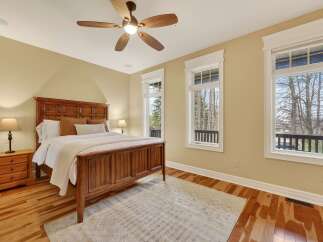 This stunning bedroom boasts a warm and inviting atmosphere, perfect for relaxation.