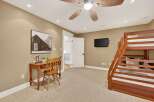 This inviting bedroom features a cozy bunk bed, perfect for accommodating guests or family.