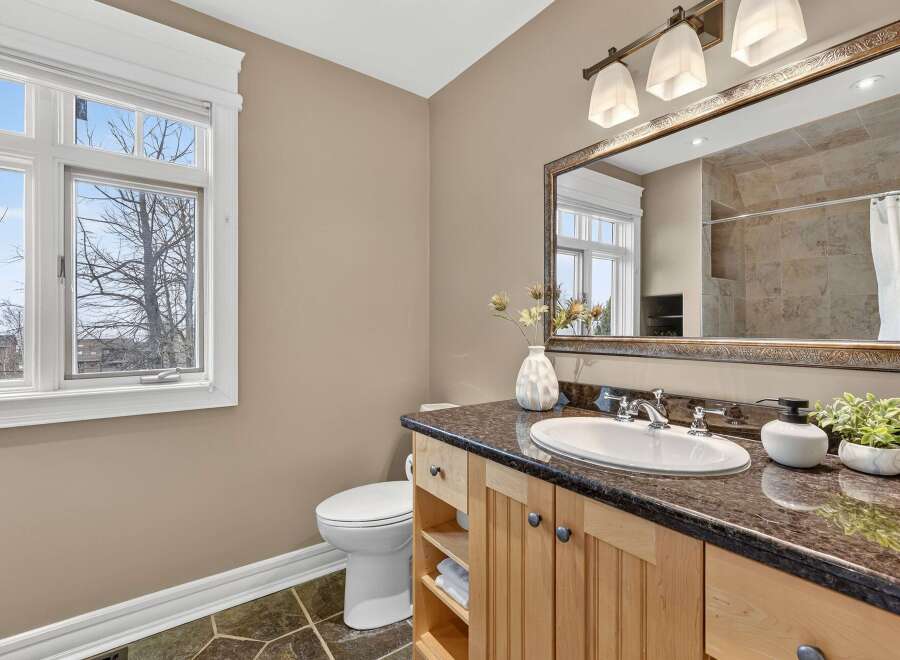This stunning bathroom boasts a modern design with a touch of elegance.
