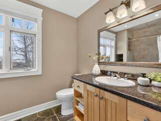 This stunning bathroom boasts a modern design with a touch of elegance.