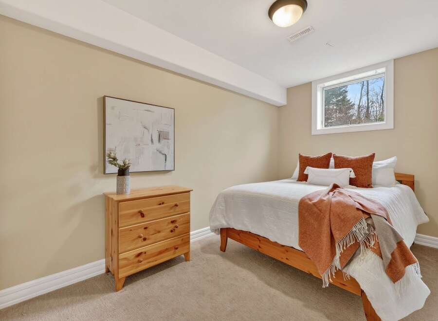 This cozy bedroom offers a warm and inviting atmosphere, perfect for relaxation.