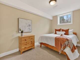 This cozy bedroom offers a warm and inviting atmosphere, perfect for relaxation.
