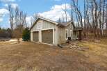 This charming property features a detached garage with two bays, perfect for storing vehicles or creating a workshop.