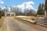 Discover this charming property featuring a detached garage and a spacious driveway, perfect for multiple vehicles.
