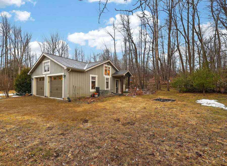 Nestled in a serene wooded setting, this charming property offers a perfect blend of comfort and nature.