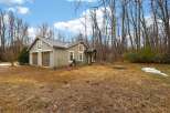 Nestled in a serene wooded setting, this charming property offers a perfect blend of comfort and nature.