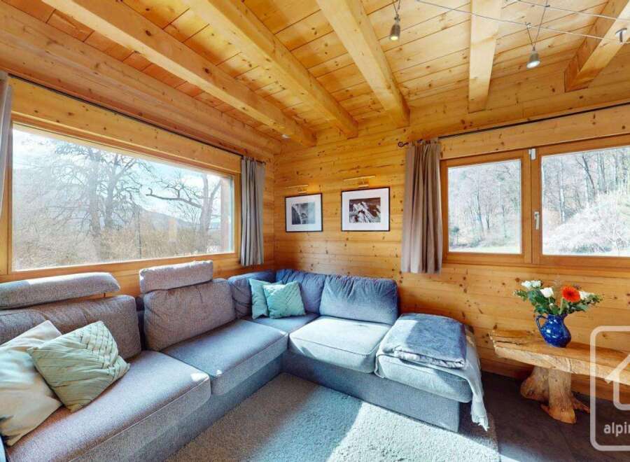 This cozy living space features a stunning wooden interior, creating a warm and inviting atmosphere.