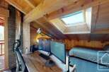 Discover the charm of this cozy attic space, perfect for a home office or a relaxing retreat.