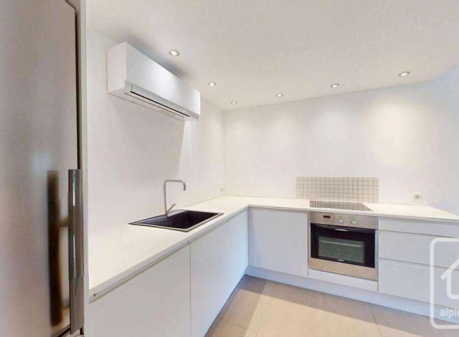 Discover modern living in this stunning kitchen! Featuring sleek white cabinetry, a stainless steel oven, and a stylish black sink, this space is designed for both functionality and elegance.