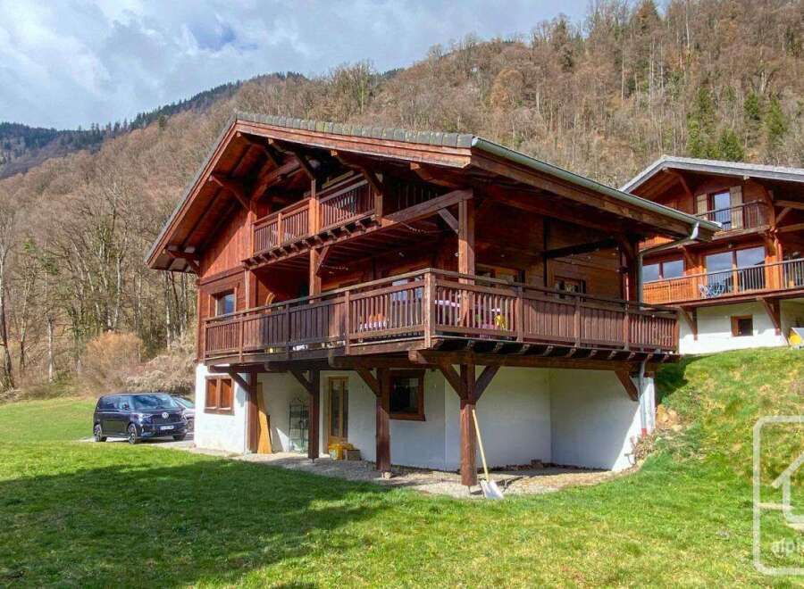 Discover the charm of this stunning wooden chalet nestled in a picturesque mountain setting.
