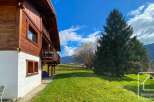 Discover the charm of this stunning property, boasting a beautiful wooden facade and a serene, grassy landscape.