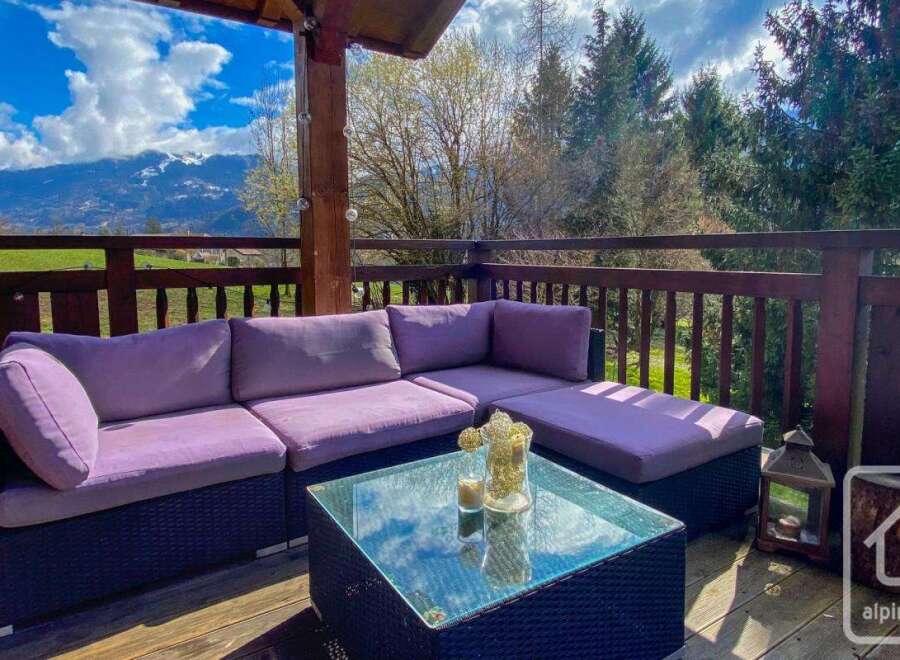 Enjoy breathtaking mountain views from this stunning outdoor living space.