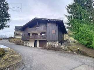 Discover this charming chalet nestled in a serene mountain setting, perfect for a peaceful retreat.