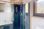 This stunning bathroom features a modern shower with multiple jets, perfect for a relaxing experience.