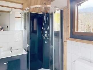 This stunning bathroom features a modern shower with multiple jets, perfect for a relaxing experience.