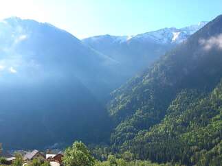 Nestled amidst majestic mountains, this property offers breathtaking views and a serene atmosphere.