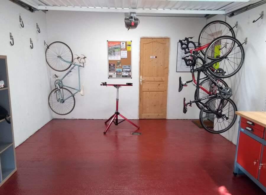 This garage is a cyclist's dream, featuring ample space for storage and maintenance.