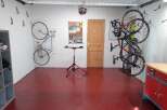 This garage is a cyclist's dream, featuring ample space for storage and maintenance.