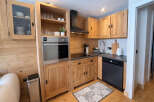Discover the charm of this beautifully designed kitchen, perfect for culinary enthusiasts.