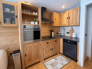 Discover the charm of this beautifully designed kitchen, perfect for culinary enthusiasts.