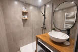 Step into this modern bathroom, featuring a sleek design and high-end finishes.