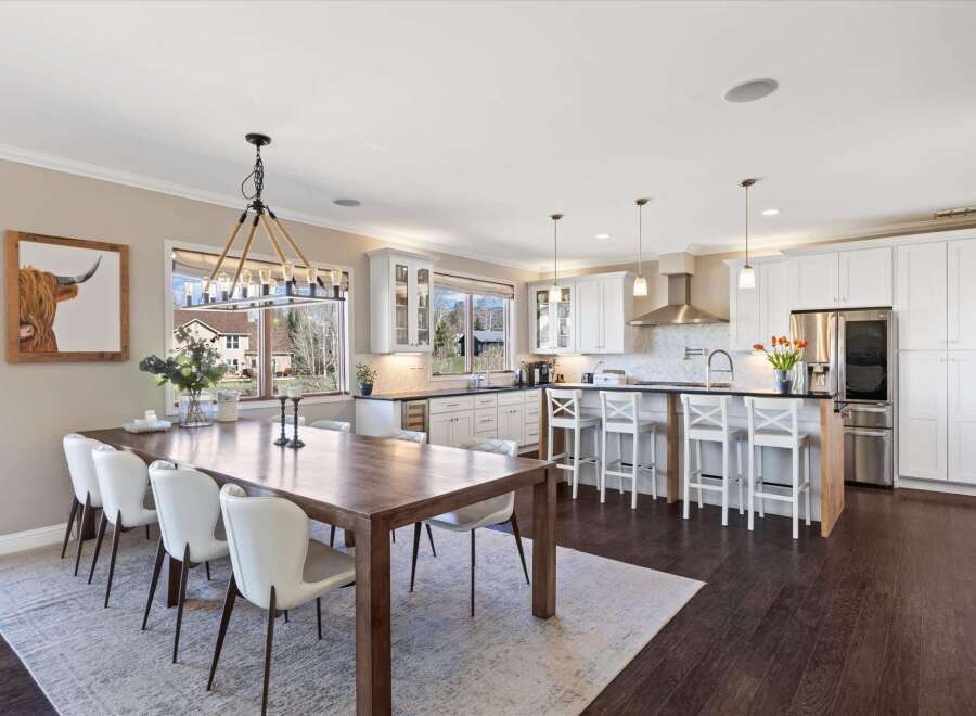 Step into luxury with this stunning kitchen and dining area.