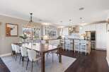 Step into luxury with this stunning kitchen and dining area.
