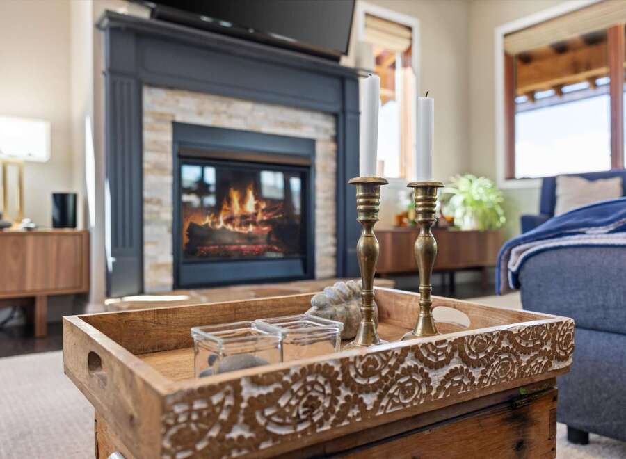 Experience the warmth and charm of this inviting living space, featuring a cozy fireplace perfect for chilly evenings.