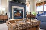 Experience the warmth and charm of this inviting living space, featuring a cozy fireplace perfect for chilly evenings.