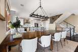 This stunning dining room showcases a beautiful blend of modern and rustic design elements.