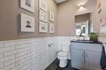 This stunning bathroom features a modern design with white subway tile and a sleek vanity.