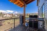 Enjoy outdoor living at its finest with this stunning property featuring a spacious deck and a fully equipped grilling area.