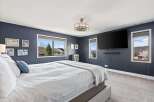 This stunning bedroom boasts a modern design with a touch of elegance.