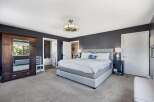 This stunning bedroom boasts a modern design with a touch of elegance.