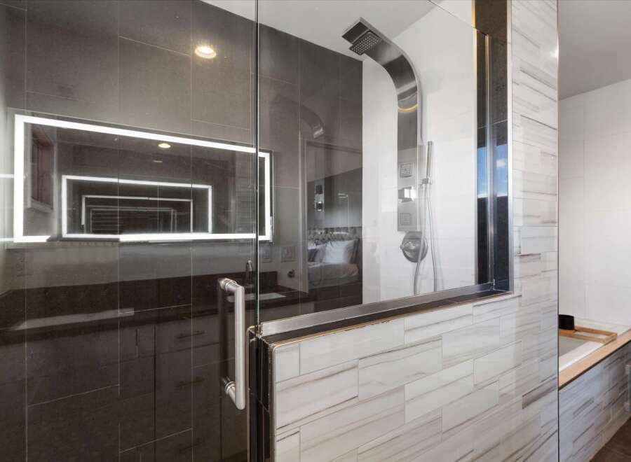 Step into luxury with this stunning bathroom! Featuring a sleek glass shower enclosure, modern fixtures, and elegant tile work, this space is designed for ultimate relaxation.