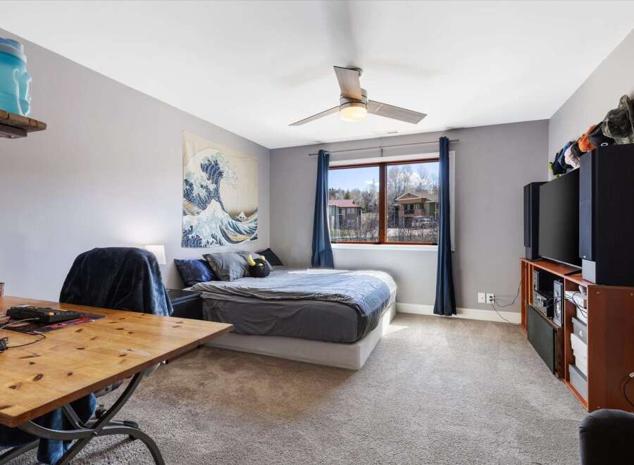 This inviting bedroom boasts a serene atmosphere, perfect for relaxation.